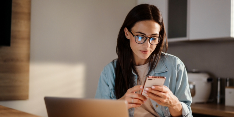 Woman scrolling on mobile phone.